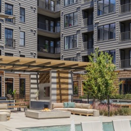 Resort-style swimming pool with lounge seating