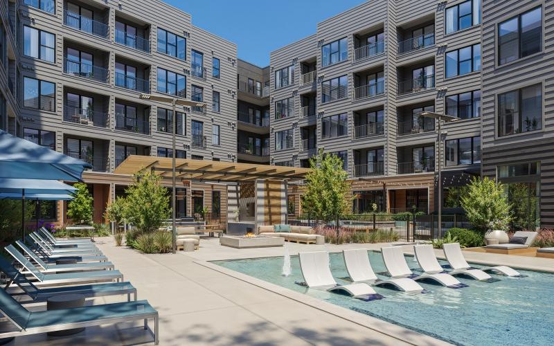 a pool with chairs around it